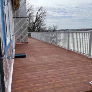 Aluminum Decking featuring a deck with wooden railing and a clear view of the surrounding area.
