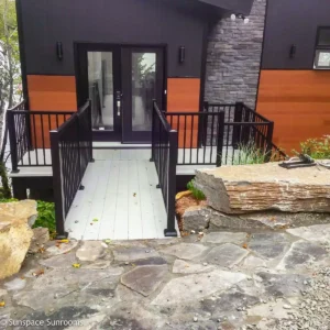 Outdoor Oasis Monochrome photo of a porch featuring wooden Railing and Aluminum Decking.