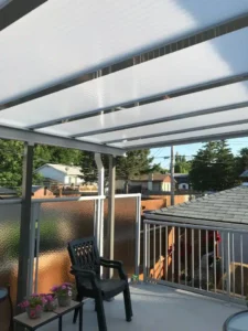 A patio featuring a white canopy, showcasing the Acrylic Patio Covers design.