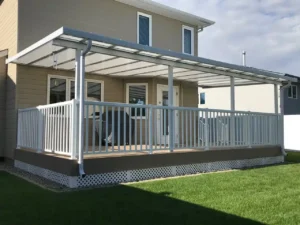 Acrylic Patio Covers featuring a patio with a white awning and a wooden deck.