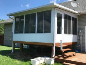 Insulated Glass Model 400 showing a screened porch with a deck and stairs, designed for outdoor living.