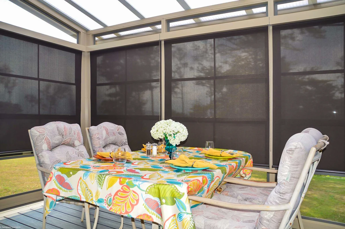 Dining table with chairs and a stylish tablecloth, showcasing the sunshade product.