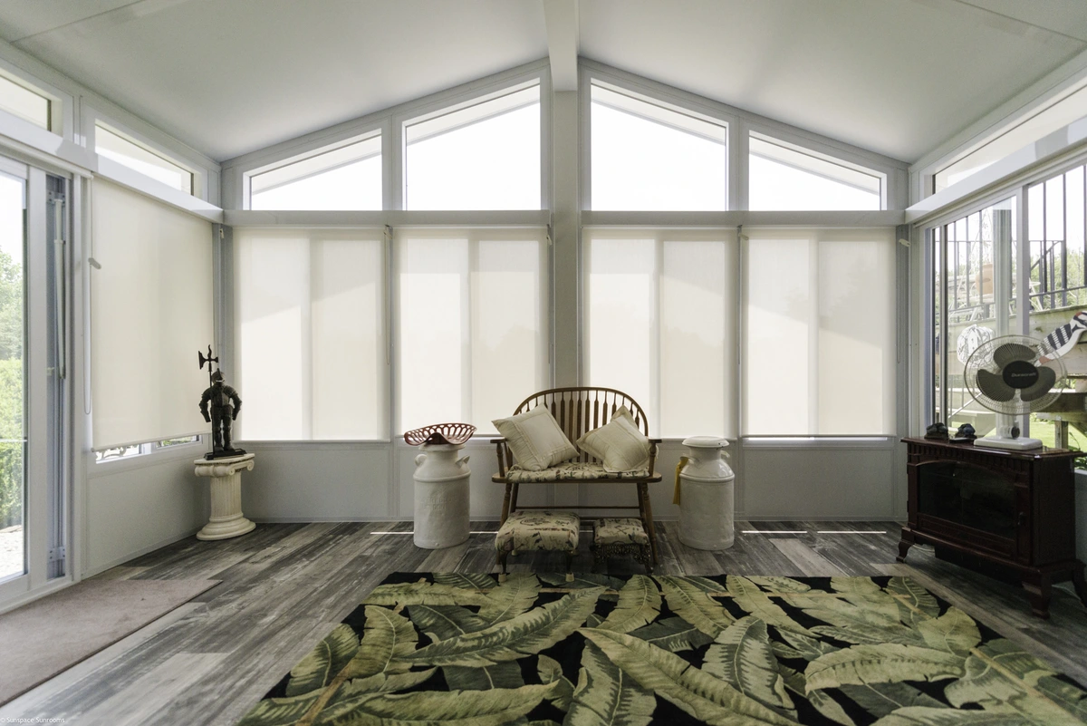 Inviting Sunroom with a spacious rug and comfortable seating, showcasing the sunshade product in a warm, cozy setting.
