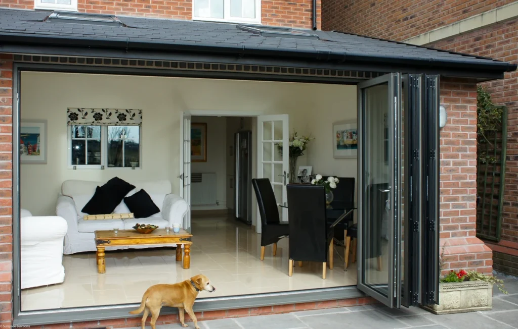 A dog positioned in front of a sliding door, highlighting the WeatherMaster™ Plus in a residential environment.