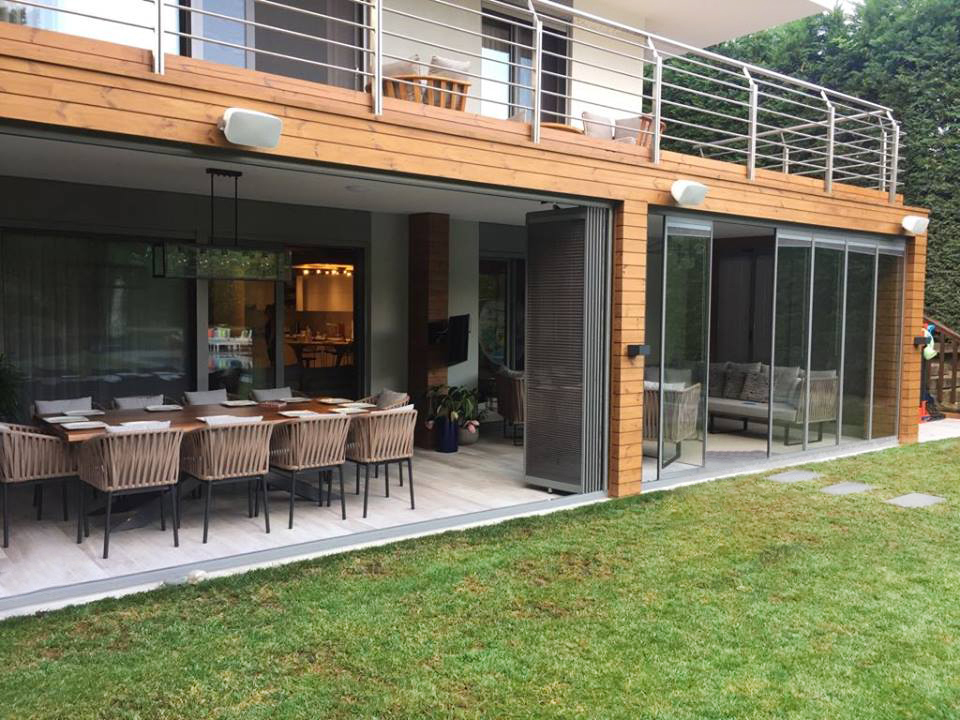 Modern residence with spacious patio and dining area.