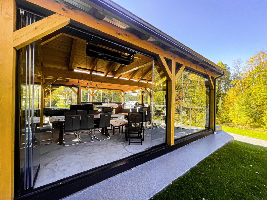 Outdoor patio with a wooden deck and grill, designed for relaxing meals and gatherings.