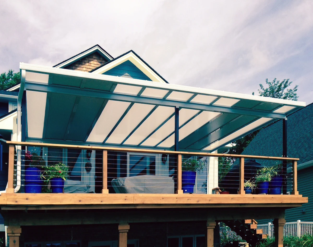 Modern Hybrid Patio Cover with solid and acrylic panels over a stylish elevated deck.