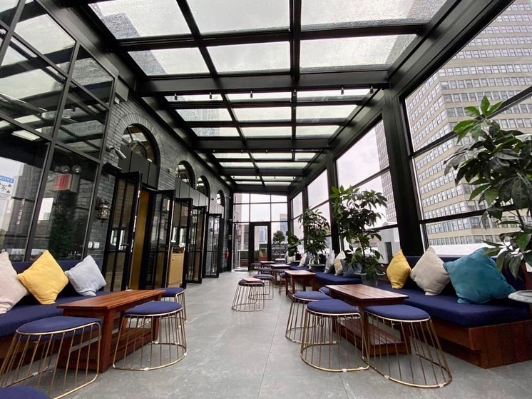 Hotel rooftop terrace with open sky and inviting seating, perfect for enjoying the view.