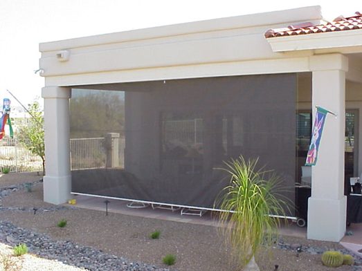 Motorized solar screen on an outdoor patio