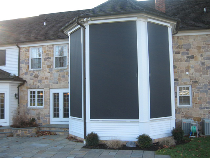 Sunair MasterShade exterior rolling solar screen on a home