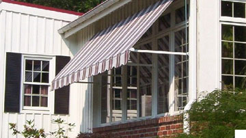 Sunair MAXI retractable window awning on a home