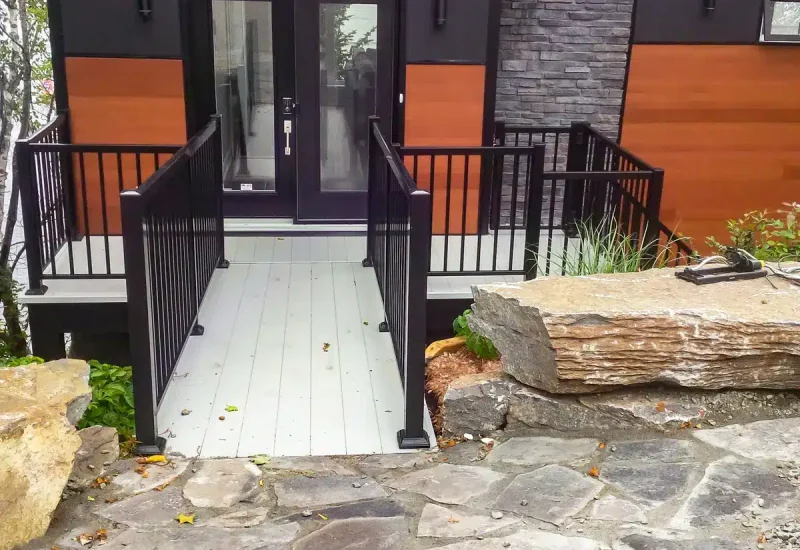 Outdoor Oasis Monochrome photo of a porch featuring wooden Railing and Aluminum Decking.