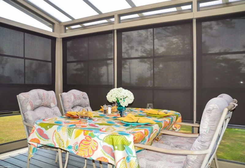 Dining table with chairs and a stylish tablecloth, showcasing the sunshade product.
