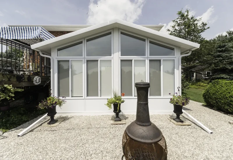Charming home with patio and fire pit, showcasing Sunshades & Sunlight products.