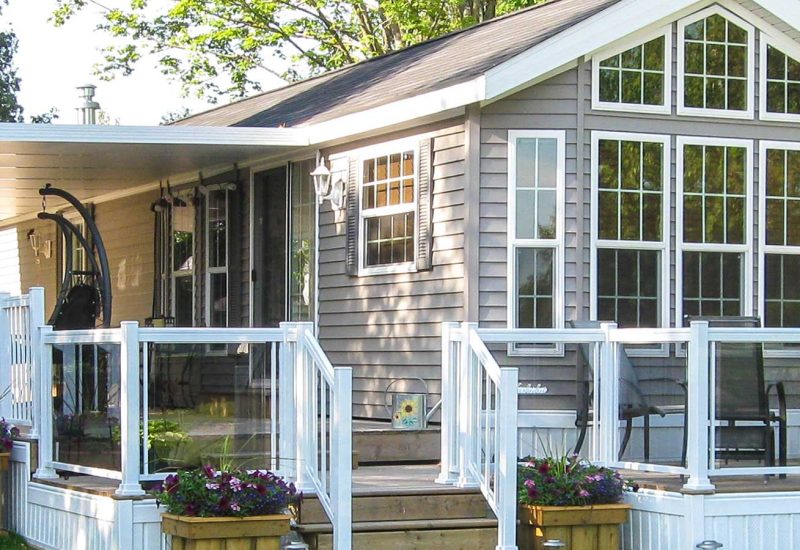 Small house featuring a porch and deck, showcasing the Insulated Glass Model 400