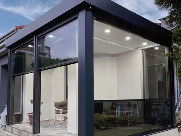 A stylish house with expansive windows and a swimming pool, set in a sunny outdoor environment.