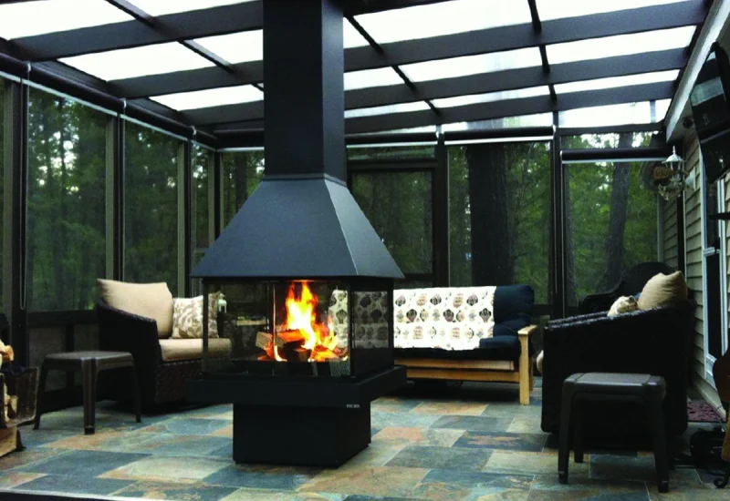 A patio featuring a fireplace and chairs, showcasing WeatherMaster™ Horizontal 2 to 4 Track Windows/Doors.