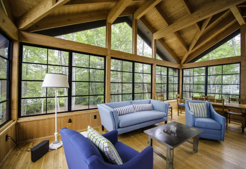 Sunroom featuring wood floors and large windows, showcasing WeatherMaster™ Windows & Doors product design.