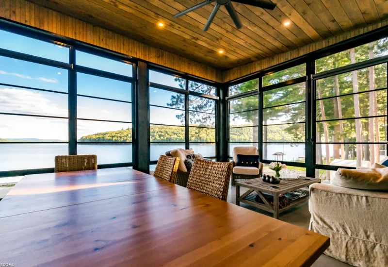 Inviting living room with WeatherMaster™ Windows & Doors, offering scenic lake views